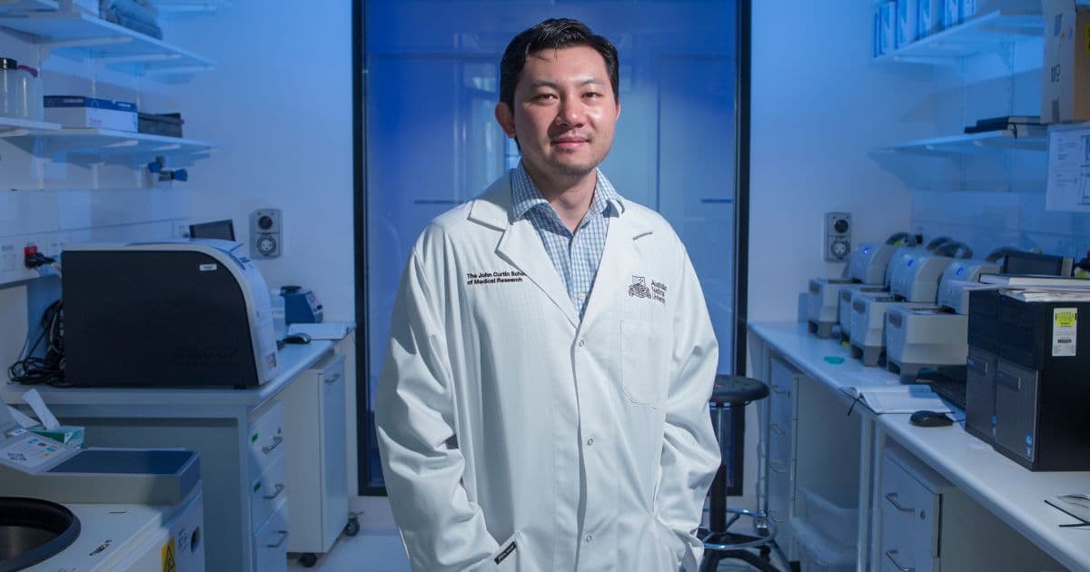 ANU scientist in a lab wearing a lab coat