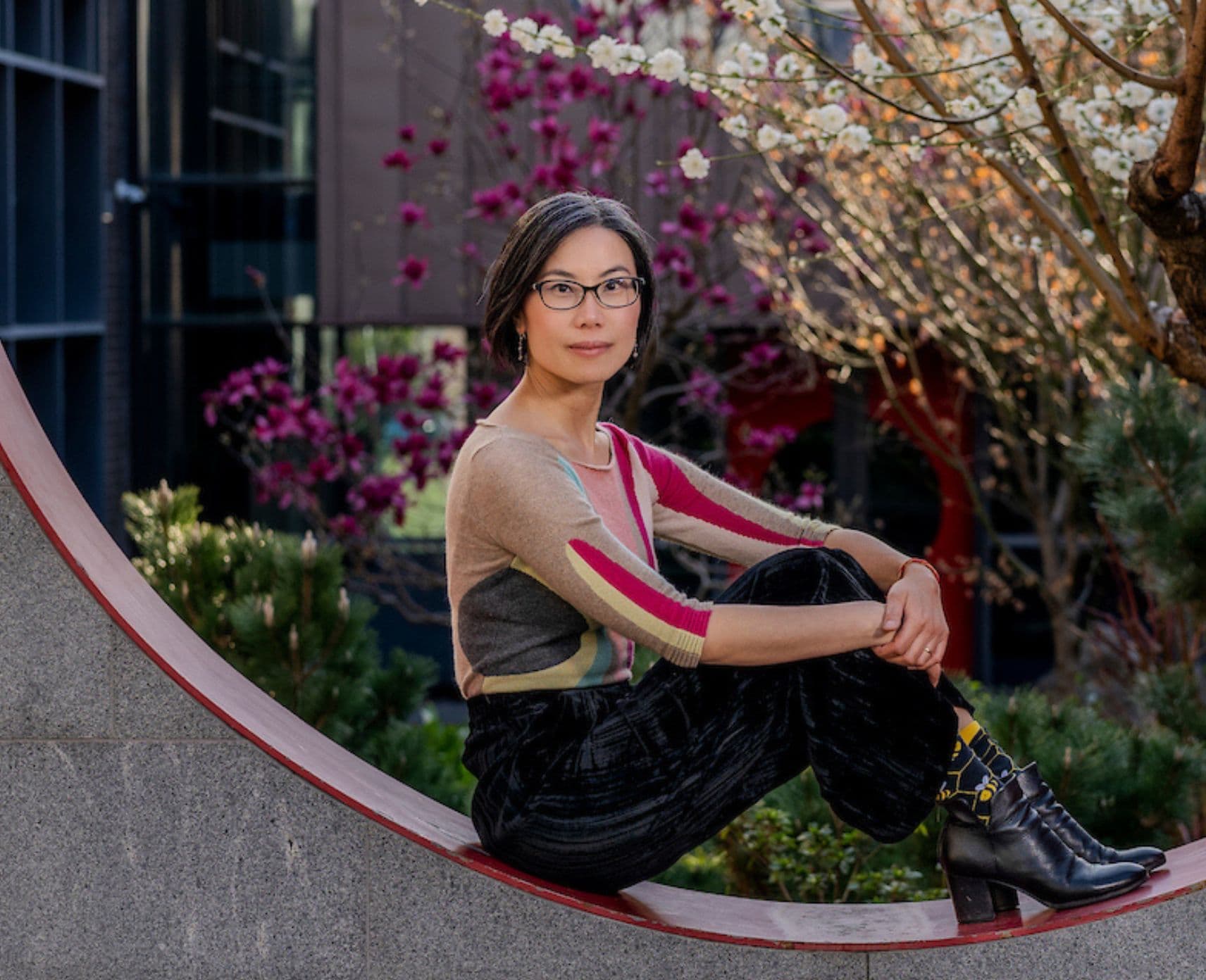 Qin Qin sits in a circular arch in the courtyard of the Australian Centre on China in the World