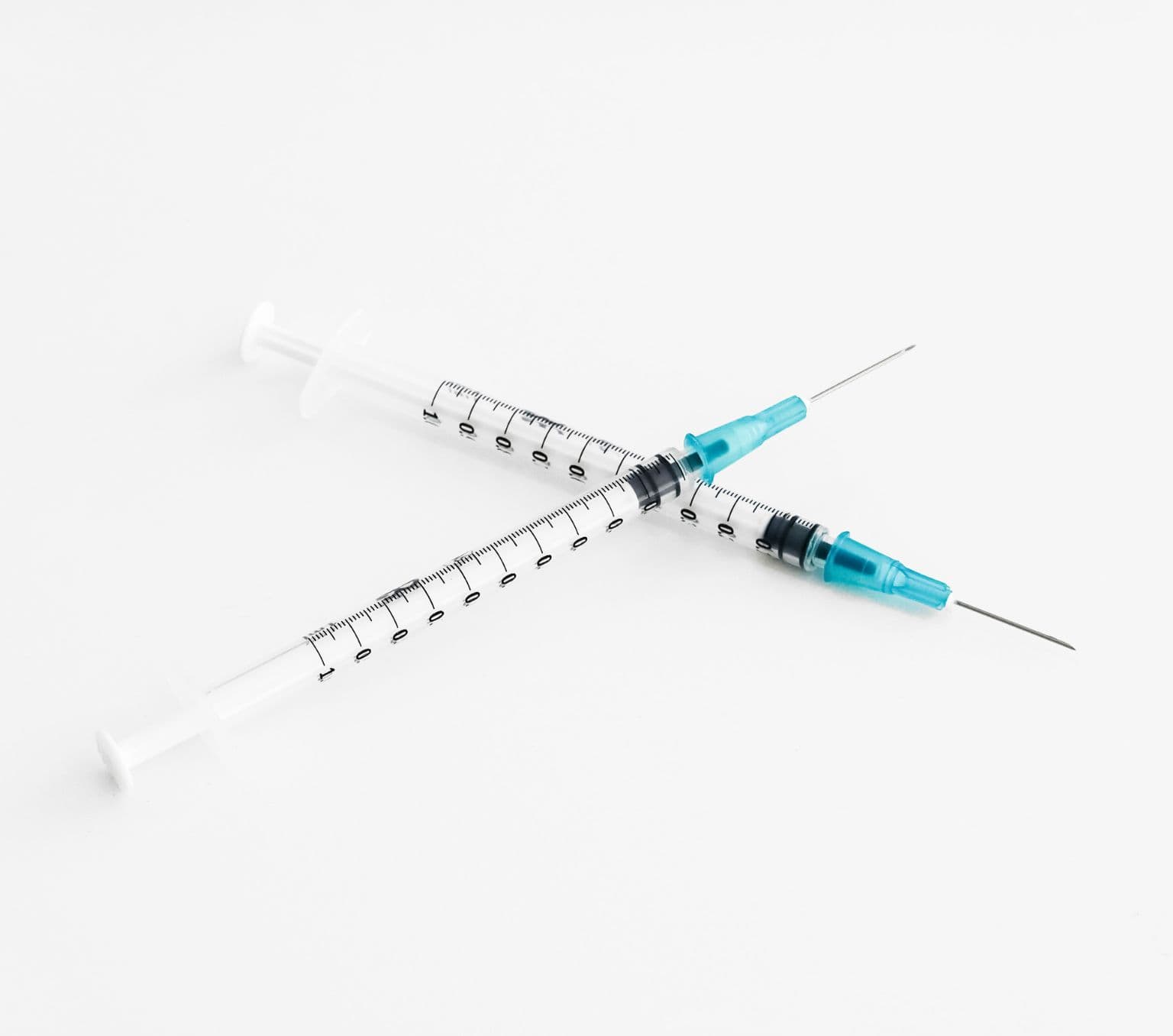 Two needles that are crossed over.