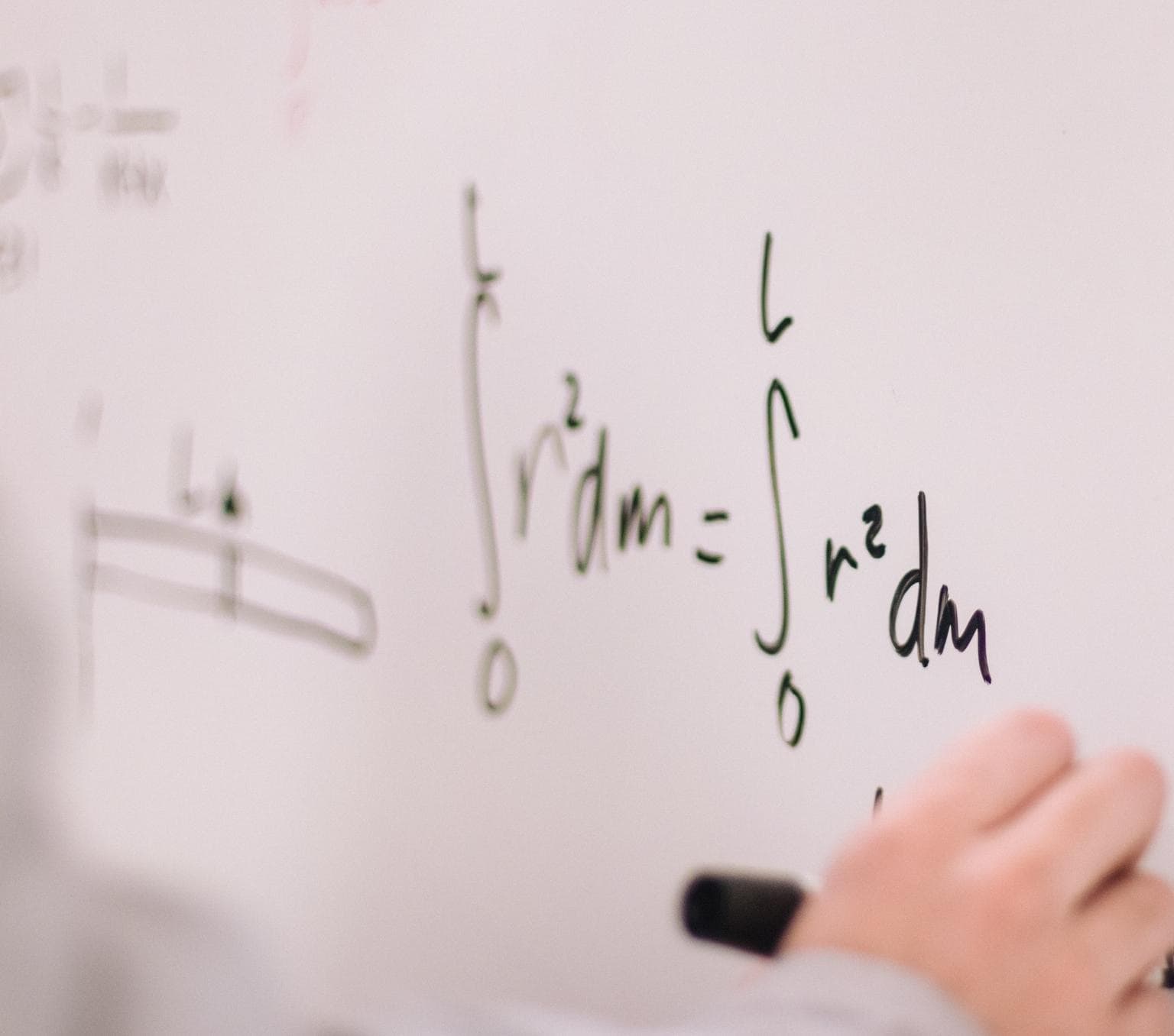 hand pictured writing out calculations