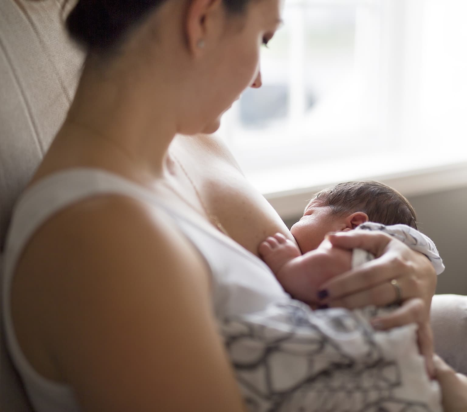 A mother breastfeeding her baby