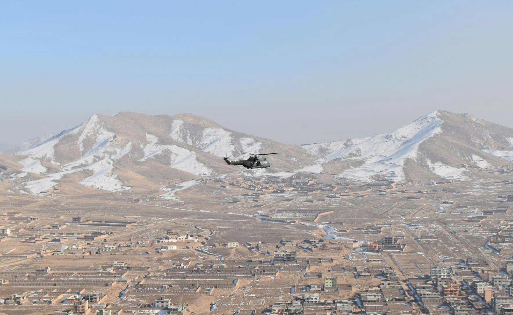 UK helicopter leaving mountainous region of Afghanistan